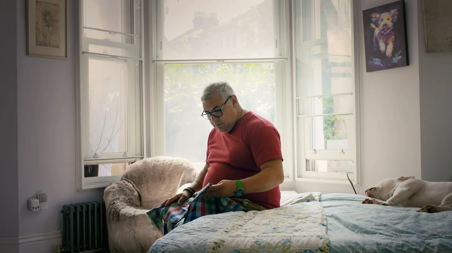 A participant holding a donated fabric in the Nike and Grenfell Athletic campaign film